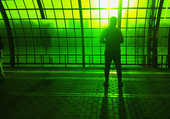 Futuristic citizen on greenish matrix platform