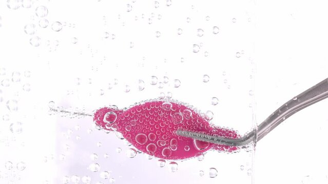 Interdental brush in a sparkling water.