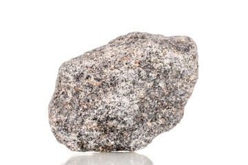 One granite stone, close-up, isolated on a white background.