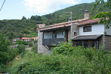 Fototapeta na wymiar Stemnitsa, Greece / July 2022: Historic traditional village at the slopes of Mainalon mountain in the Peloponnese.