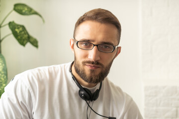 Headshot portrait of happy millennial man in casual clothes isolated on grey studio background posing, smiling young male in shirt look at camera with wide healthy teeth, demonstrated dental treatment