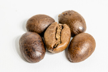 roasted coffee beans on white background