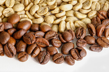 roasted and unroasted coffee beans on white background
