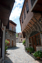 Stemnitsa, Greece / July 2022: Historic traditional village at the slopes of Mainalon mountain in the Peloponnese. Medieval street.