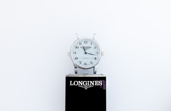 Longines classic style watch in showroom against white background