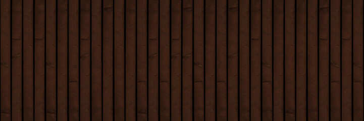 Old brown rustic dark wooden boards texture - wood panel wall timber background panorama banner, seamless long pattern