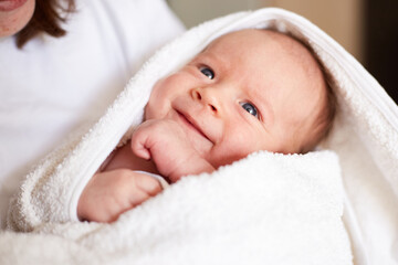 Smiling newborn one month old baby boy. smiling baby