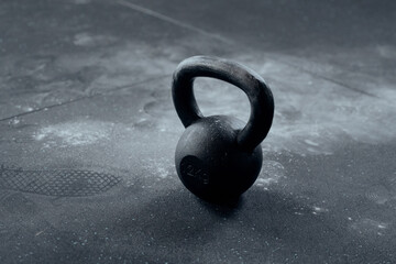 Naklejka na ściany i meble Close-up of kettlebell with chalk around at the gym