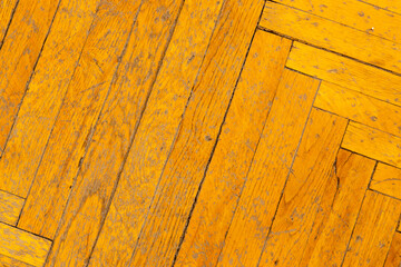 Background, texture of the surface of an old wooden parquet