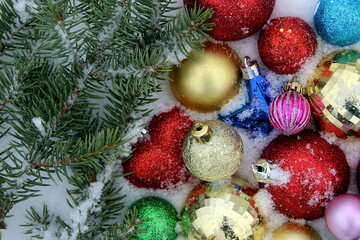 Fototapeta na wymiar Bright Christmas toys lie on the snow.