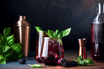 Bramble blackberry cocktail served  in a long drink glasses, front view of ready to drink alcohol