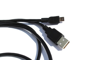  The black cable for connection lies on a white isolated background.