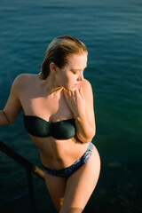 Blonde girl near the sea