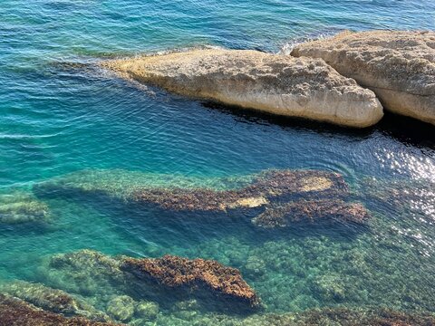 Sea turquoise clear water and scenic rocky coastline.
