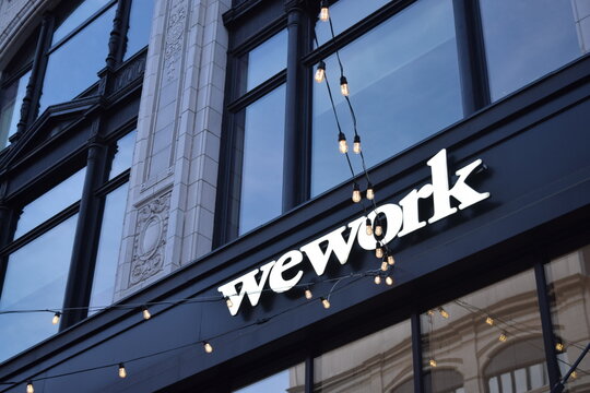 WeWork sign on the facade of an old building in Detroit, Michigan in December 2019. Coworking space for rent in big city