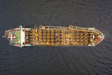 Shipment of excavators and other equipment on the deck of a cargo ship