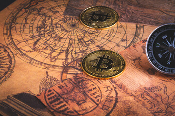 Fototapeta na wymiar Compass and bitcoin. Travel and cryptocurrencies. Buying tickets with bitcoins.