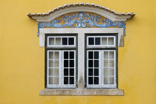 Portugal, Santarem, Yellow building with traditional tile work