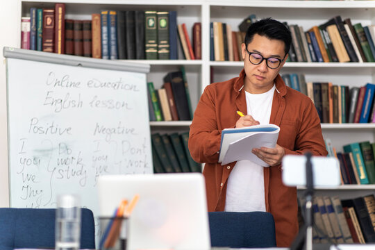 Korean Tutor Man Teaching Having Online Class In Modern Classroom