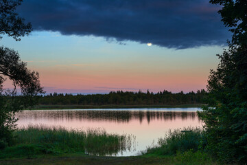 Fototapeta na wymiar Serene landscape with a lake in the evening