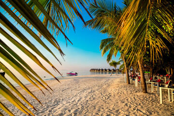 Landscape on Maldives island, luxury water villas resort and wooden pier. Beautiful sky and ocean...
