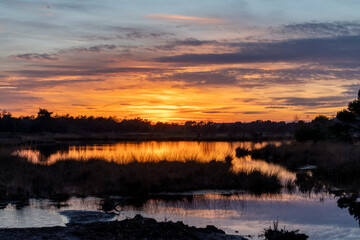 Sunset view over lakeside with beautiful colours and reflection