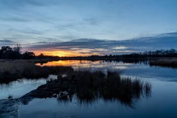 Sunset view over lakeside with beautiful colours and reflection
