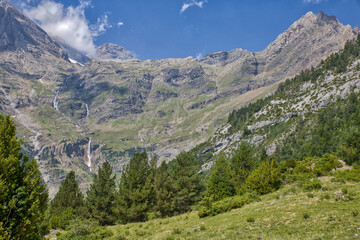 Fototapeta na wymiar view to the spanish pyrenees with a waterfall in the mountain