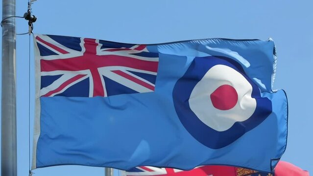 A waving Royal Air Force Ensign flag during sunny day.