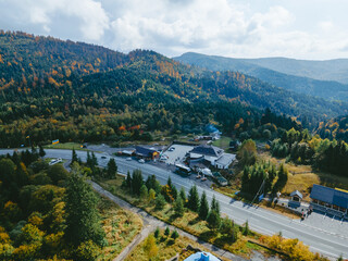 aerial view of speedway road in autumn carpathian mountains