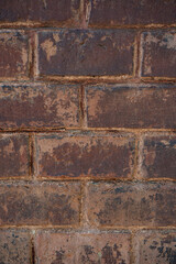 Old brick wall with ruined bricks. Aged grunge wall background. Vintage Texture. Vertical Web banner or Wallpaper With Copy Space for design.