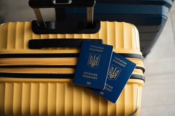 Passport on the background of the baggage. Emigration, immigration, refugee, evacuation of...