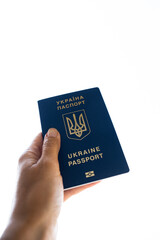 Passport on the white background. Emigration, immigration, refugee, evacuation of civilians, families from Ukraine crossing border. Stop war, support, care concept. Hand. Space for your text.