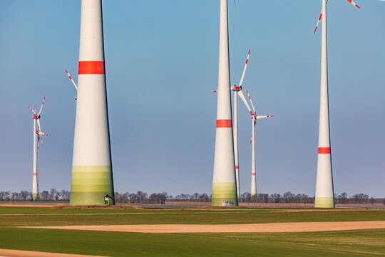 Massive Towers Of A Wind Farm Dominate A Rural Landscape In Germany