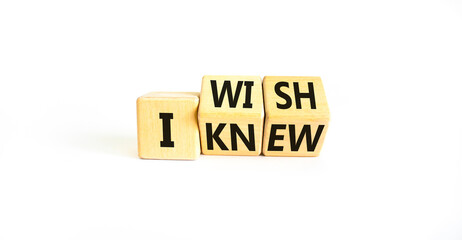 I knew or wish symbol. Concept words I knew and I wish on wooden cubes. Beautiful white table white...