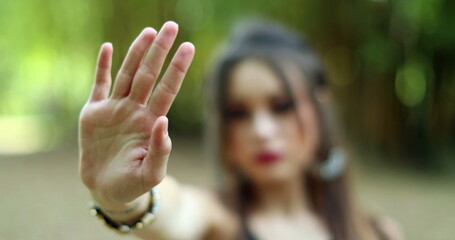 Obraz premium Young Woman Rejecting Offer by Waving Finger