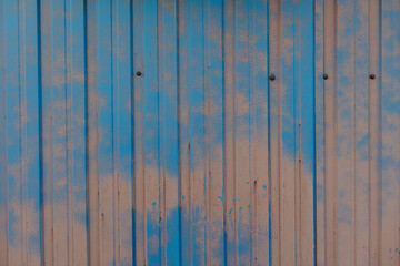 Fototapeta premium Rusty metal fence remain painted in places where it didn't fell off