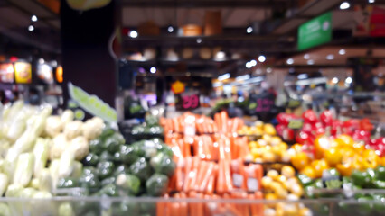 blurred view of supermarket , fruit and vegetable zone. defocused of  grocery store showing various type of fruits and vegetables showing on shelves.