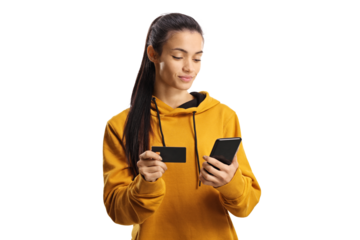 Young woman shopping online with a credit card and a smartphone