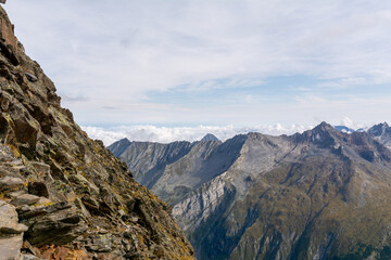 Fototapeta na wymiar Impressive alpine view of high peaks in summer