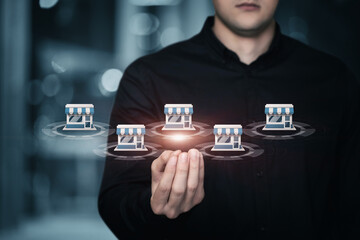 Businessman showing franchise structure on blurred background.