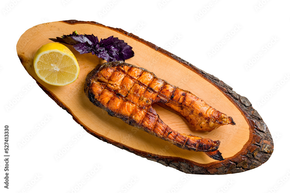 Wall mural salmon fillet cooked on the grill with lemon and basil on wooden board isolated on white background top view