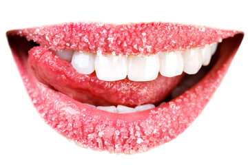 Closeup of woman's lips covered with sugar. Toothy smile