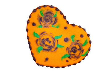 Halloween treats. Delicious orange gingerbread in the form of a heart on the Halloween theme.