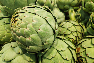 Fototapeta premium Stack of artichokes on a market stall