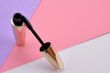 open black mascara on pink purple background