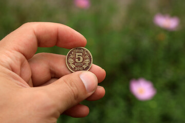 Vintage coin of India in hand