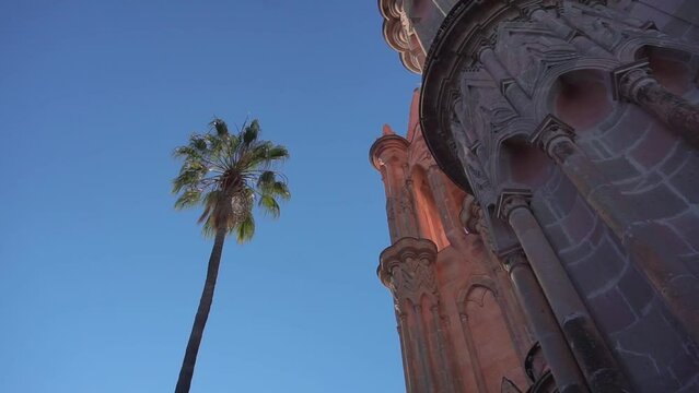 Smooth Gimbal Footage of great Parroquia de San Miguel Arcangel pink sandstone church in San Miguel de Allende, Mexico
