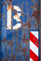 Surface of an old blue rusty container