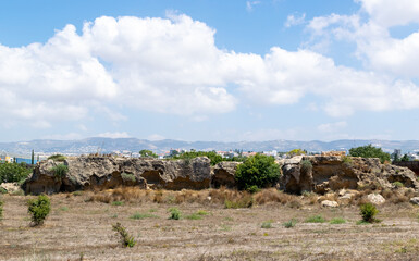 Cyprus landscape. View of the city. Limestone buildings by the sea. Sea and mountains.